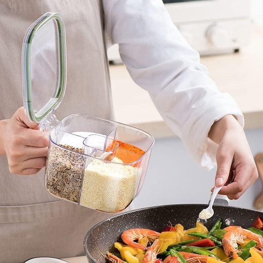 Person using a spice container to add seasonings to a pan of food